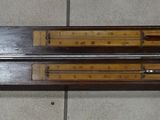 a wooden shelf with a clock on it on the floor