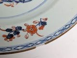 a plate with a blue and orange design on it