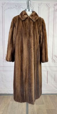 an image of a fur coat on a mannequin stand in a room