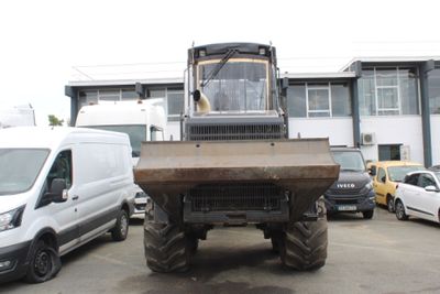 a large tractor that is parked in a parking lot