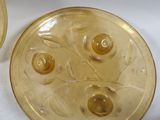 two yellow glass plates sitting next to each other