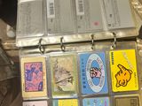 a metal case with many cards in it on a table