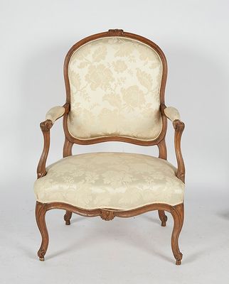 pair of louis xv style carved wood armchairs with upholstered upholstered arms