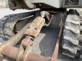 a close up view of a tractor that is parked in the dirt