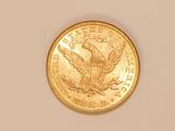 an image of a gold coin on a white surface
