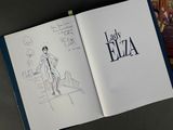 an open book with a drawing of a man in a suit