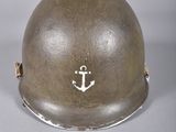 an image of a helmet with an anchor on it sitting on a table