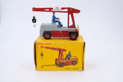 a small toy truck with a crane on top of it
