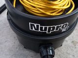 a close up of a black bucket with a yellow cord in it