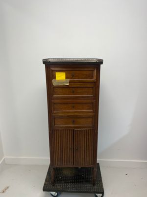 an image of a wooden cabinet with a yellow label on it