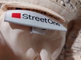 a close up of a street one label on a sweater