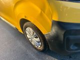 a close up of a yellow car with a black bumper