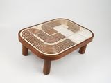 an image of a wooden table with a geometric design on it