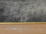 a blackboard on the wall with a yellow frame