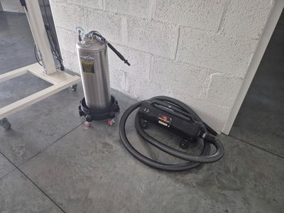 a fire extinguisor and a hose on the floor