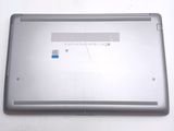 a silver laptop with a blue sticker on it