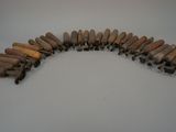 an image of a group of wooden pegs sitting on top of a table