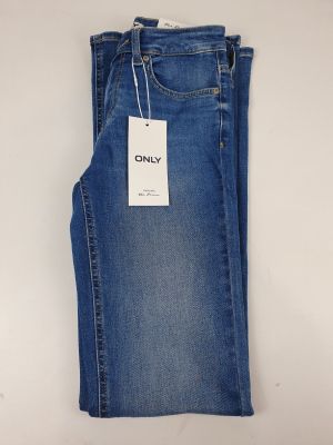 a pair of jeans hanging on a hanger on a wall