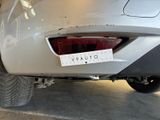 a sticker on the back of a car that is parked in a garage