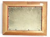 painting of a wooden frame with writing on it and a mirror