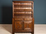 an old wooden cabinet with drawers and drawers on top of it
