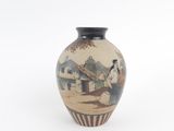 a small vase with a painting on it on a white surface