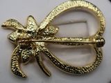 yellow gold plated brooch pin with a flower design