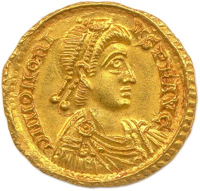 a gold coin with an image of a man wearing a headdress