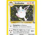 a close up of a pokemon card on a white surface