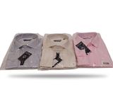 three men ' s dress shirts in plastic bags on a white surface