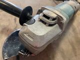 a close up of a small electric tool on a table