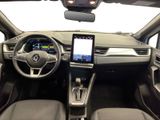 a picture of a car dashboard with a tablet on the dashboard