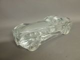 a clear plastic car that is sitting on a table