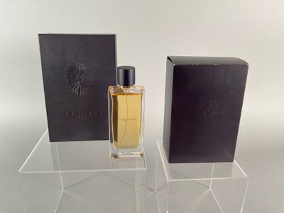 an image of a bottle of perfume sitting next to a box