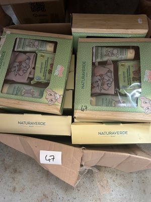 two boxes of soaps sitting on top of a cardboard box