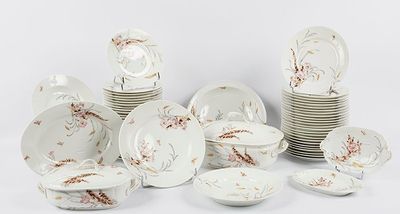 a lot of plates and bowls that are sitting on a table