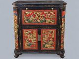 a black and red cabinet with gold decorations on it