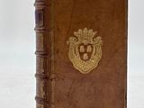 an old book with a lion emblem on the front of it