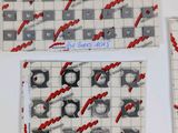 a picture of a game of tic - tac - tac - toe on the table