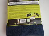 the back of a pair of blue socks on a white surface