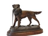 bronze statue of a dog with a pheasant in its mouth