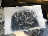 a black and white photo of a group of men in uniform
