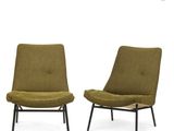 pair of lounge chairs in olive green fabric with black metal legs