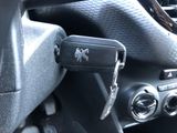 a car dashboard with a remote control and a key in it