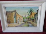 a picture of a painting of a street scene in a picture frame