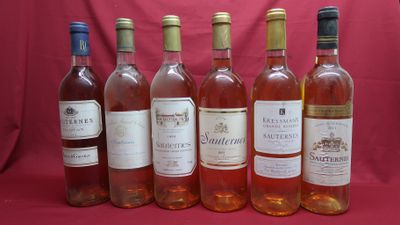 six bottles of wine are lined up in a row on a red background