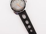 an image of a watch on a white surface with a white background