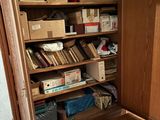 a wooden cabinet with a book shelf in it
