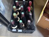 many bottles of wine in a crate on the floor
