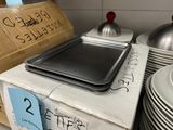 a stack of plates and pans sitting on a counter